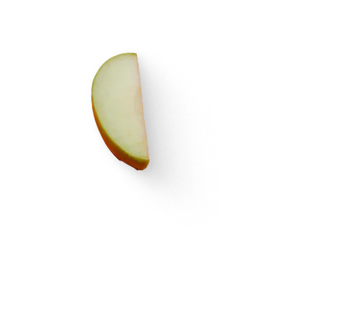 An apple sliced in half on a black background